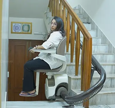 Elite Elevators customer smiling after successful stairlift installation